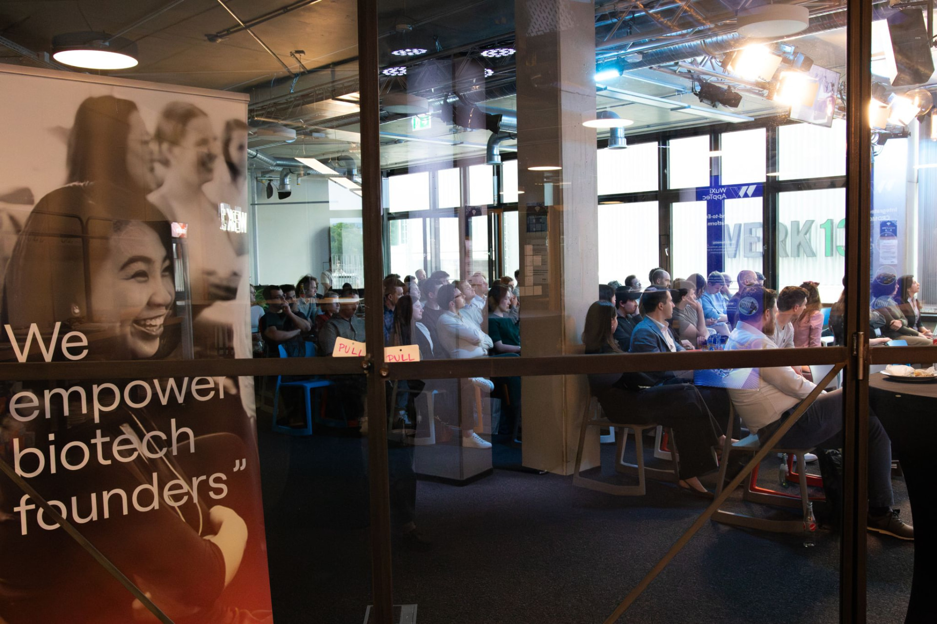 The Semi-Final Pitch Day room at WERK1, seen through the doors.