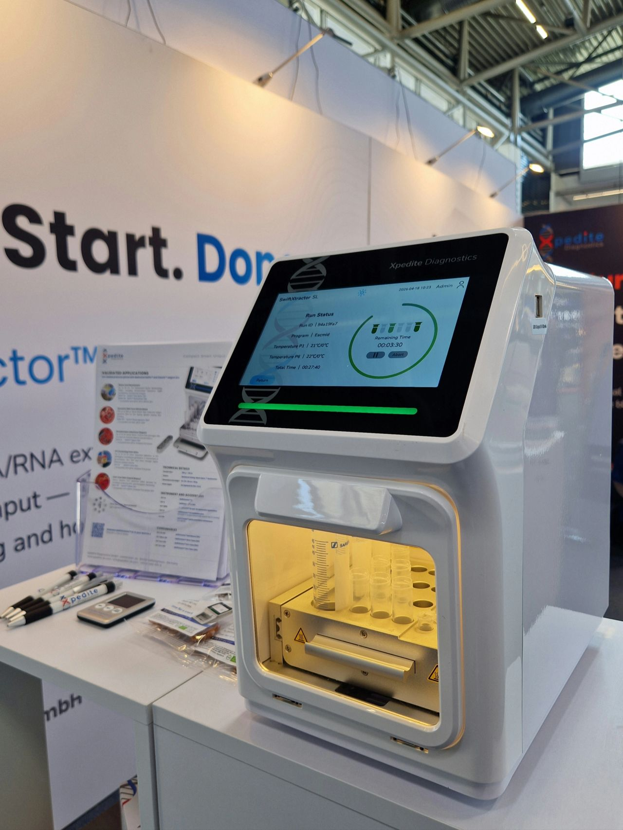 SwiftXtractor SL on the booth bench with validated application notes.